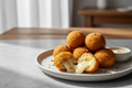 bolitas de papa rellena de queso que la imagen se vea bien iluminada y realista